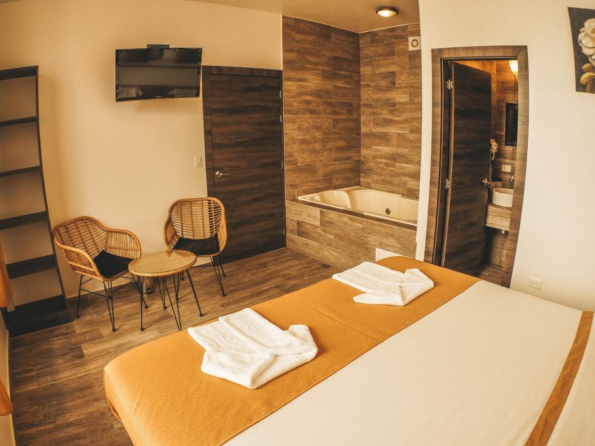 Toucan Platinum Suites Aparthotel Миндо Экстерьер фото